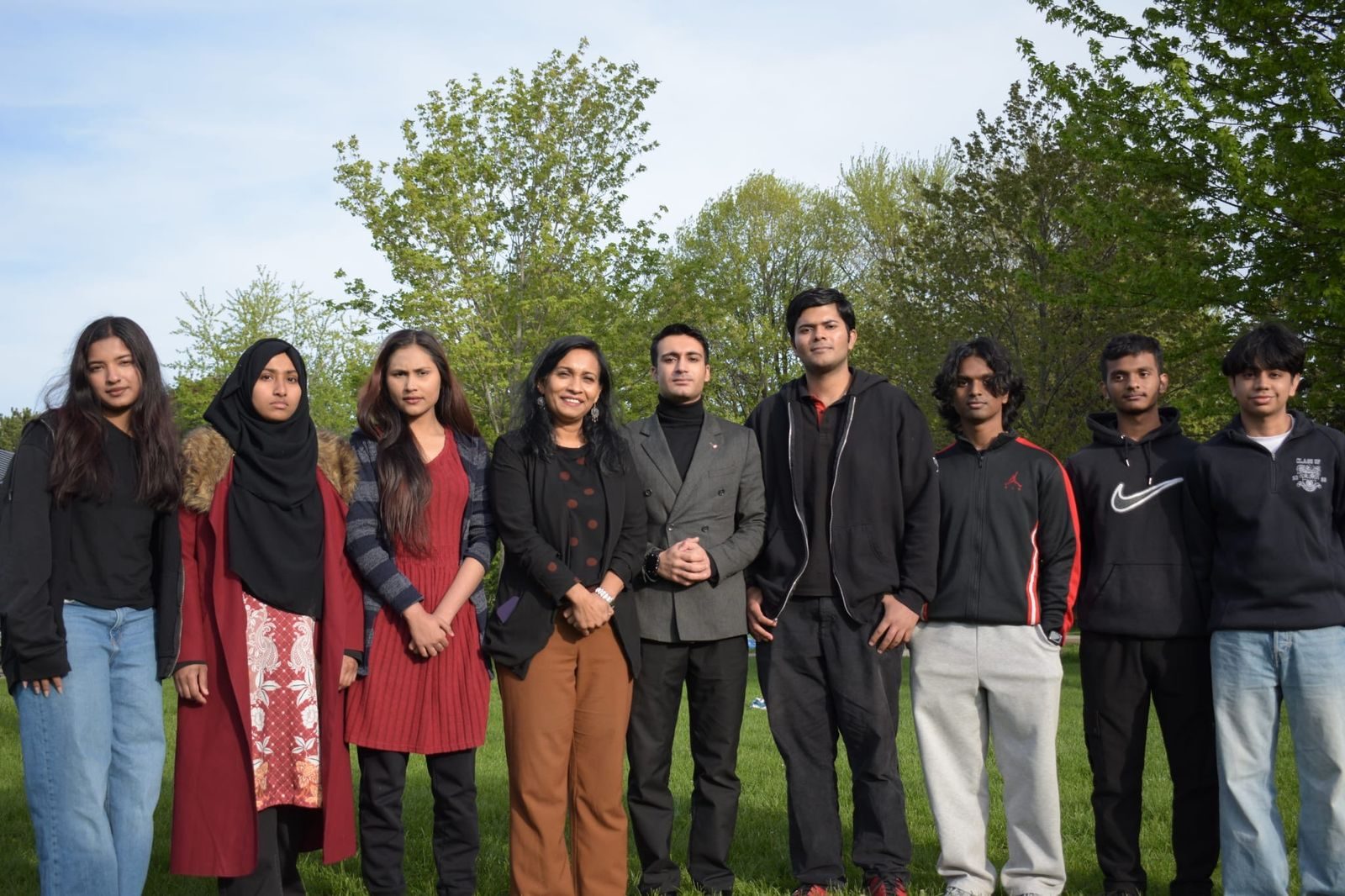 Sharmina Nasrin standing with campaign volunteers